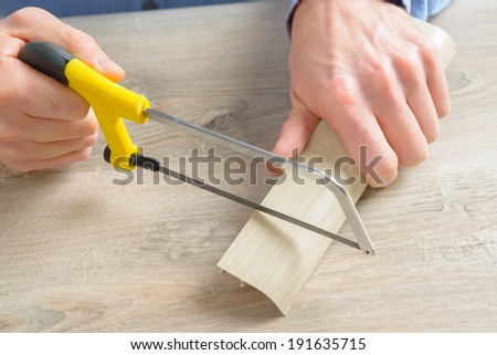 Cutting plastic molding with small handsaw at home