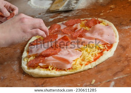 Fresh original Italian raw pizza, dough preparation in traditional style.