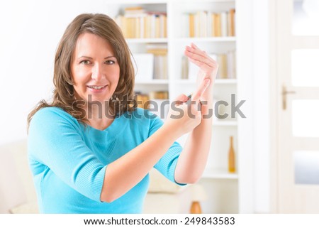 Woman doing EFT on the karate chop point. Emotional Freedom Techniques, tapping, a form of counseling intervention that draws on various theories of alternative medicine.