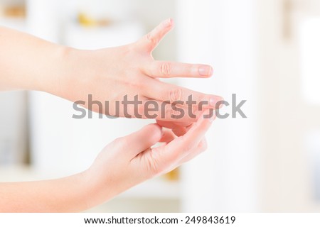 Woman doing EFT on the finger point. Emotional Freedom Techniques, tapping, a form of counseling intervention that draws on various theories of alternative medicine.