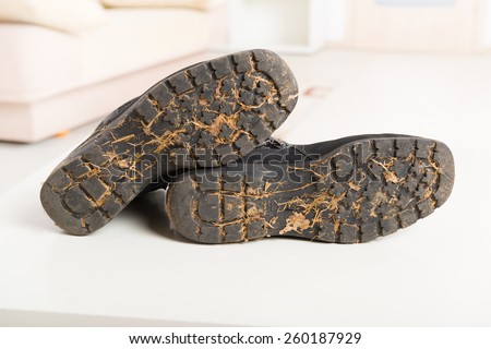 Dirty soles of black woman\'s shoes