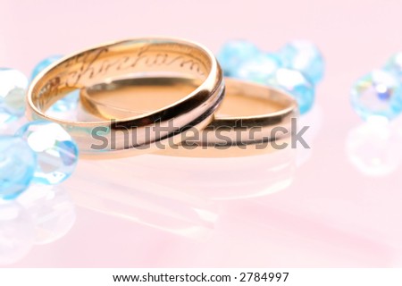 Wedding ring and a glassy beads.