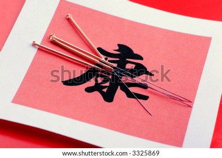 Needles for acupuncturist shown on Chinese Health sign.