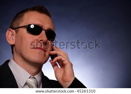 Portrait of business man, politician, body guard or politician with mobile phone