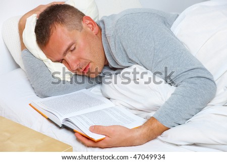 Sleeping man with open book