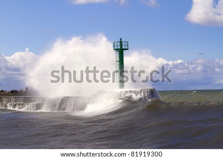 Huge wave crashed against the breakwater near the seaport