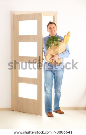 man entering house