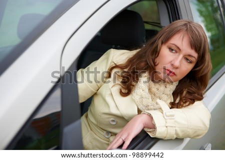 Frustrated young woman stuck in a traffic jam