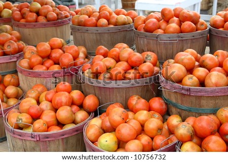Tomatoes in baskets at a road side farm stand