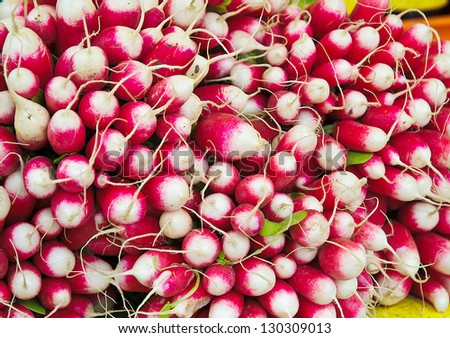 Fresh red and white radishes in a market