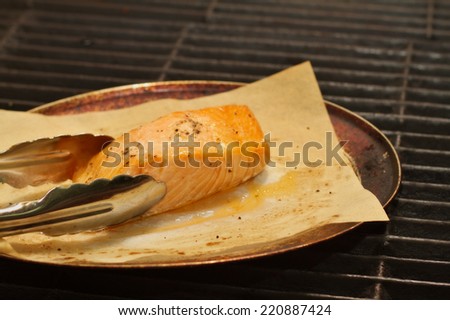 Chef preparing a salmon dish