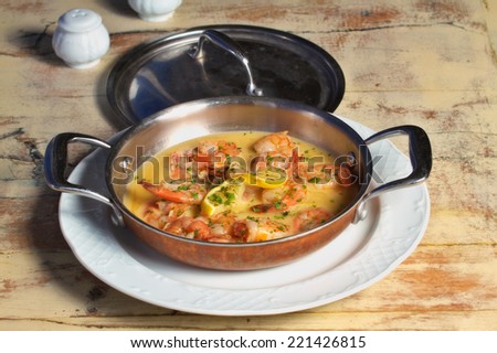 Shrimps in a garlic butter sauce dish