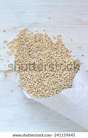 Pearl Barley on a vintage wooden background