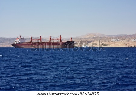 Cargo ship entering the harbor at the Red Sea