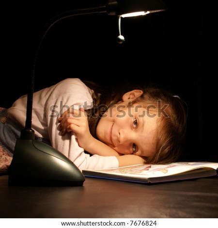The girl is tired to read the book