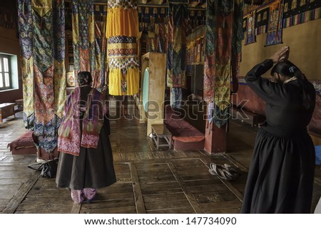 DISKIT,LADAKH,INDIA-OCTOBER 14:Two old woman praying at Diskit monastery temple on October 14,2102 in Diskit,Ladakh,India.Diskit is in the Nubra valley northern of Ladakh.