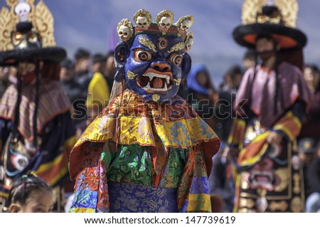 DISKIT,LADAKH,INDIA-OCTOBER 14:Traditional artists perform Cham dance(masked danc is some sects of Buddhists) during Diskit Festival at Diskit monastery on October 14, 2012 in Diskit,Ladakh, India.