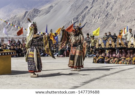 DISKIT,LADAKH,INDIA-OCTOBER 14:Traditional artists perform Cham dance(masked danc is some sects of Buddhists) during Diskit Festival at Diskit monastery on October 14, 2012 in Diskit,Ladakh, India.