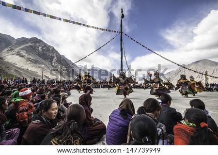 DISKIT,LADAKH,INDIA-OCTOBER 14:Traditional artists perform Cham dance(masked dance is some sects of Buddhists) during Diskit Festival at Diskit monastery on October 14, 2012 in Diskit,Ladakh, India.