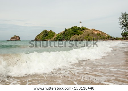 Lighthouse and the waves,thailand