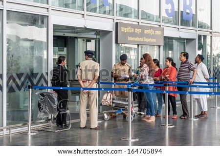 KOLKATA,INDIA - APRIL 19:The security police check ticket of passenger for International departures at new terminal of Kolkata airport  on April19, 2013 in Kolkata,India.