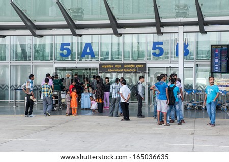 KOLKATA,INDIA - APRIL 19:The security police check ticket of passenger for International departures at new terminal of Kolkata airport on April 19, 2013 in Kolkata,India.