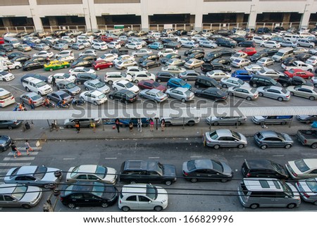 BANGKOK-DEC 07:Cars parked at a park and side lot at a BTS station in Chatuchak district on December 07,2013 in Bangkok,Thailand.The government has promoted park and ride to reduce traffic congestion.