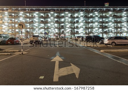 BANGKOK-DECEMBER 17:Parking building with cars in Suvarnabhumi Airport at night on December 17, 2013 in Bangkok ,Thailand.This airport is handling about 45 million passengers annually.