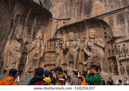 Luoyang - Oct 22: Visitors At Longmen Grottoes On October 22, 2013.It Is One Of The Four Notable Grottoes In Luoyang,Henan,China . A Unesco World Heritage Site.