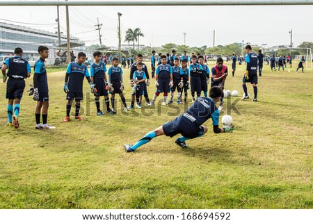 BANGKOK-DECEMBER 15:Young boys of air force united F.C youth team practicing for goalkeeper on December 15,2013 in Bangkok,Thailand.