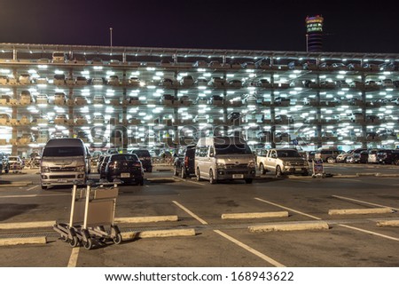 BANGKOK-DECEMBER 17:Parking building with cars in Suvarnabhumi Airport at night on December 17, 2013 in Bangkok ,Thailand.This airport is handling about 45 million passengers annually.