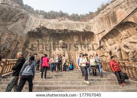 LUOYANG,CHINA - OCT 22: Visitors at Longmen grottoes on October 22, 2013.It is one of the four notable grottoes in Luoyang,Henan,China . A UNESCO World Heritage Site.