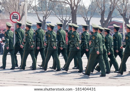 BEIJING,CHINA - MARCH 29 ,2011 : Team of soldier walk at Tiananmen gate in Forbidden city in Beijing,China.It is located in the center of Beijing, China, and now houses the Palace Museum.