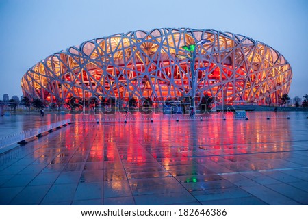 BEIJING,CHINA - APRIL 01 , 2011 : Bird\'s Nest is a Beijing National Stadium at night after rain in Beijing, China. The stadium was established for the 2008 Summer Olympics and Paralympics.