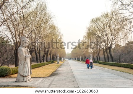BEIJING,CHINA - MARCH 30 ,2011 : Visitors at Avenue of the Animals, Beijing, China. In the site there are tombs of most emperors of the Ming dynasty, who ruled in China from 1368 to 1644.