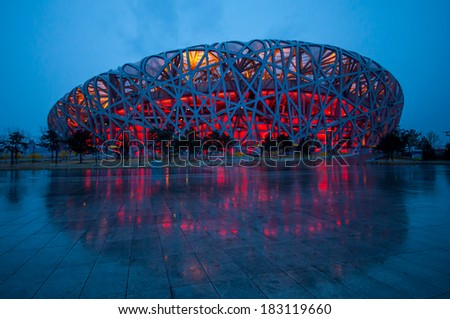 BEIJING,CHINA - APRIL 01 , 2011 : Bird\'s Nest is a Beijing National Stadium at night after rain in Beijing, China. The stadium was established for the 2008 Summer Olympics and Paralympics.