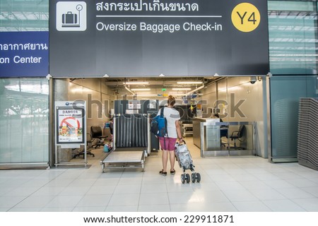 Bangkok,Thailand-August 31,2014 : :Passengers arrive at oversize baggage check in desk  in Suvarnabhumi Airport  in Bangkok ,Thailand.This airport is handling about 45 million passengers annually.