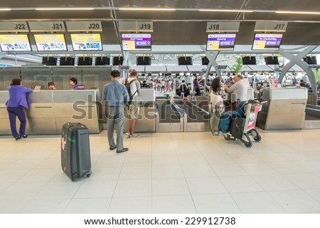 Bangkok,Thailand-August 31,2014 : Passengers arrive at check in desk  in Suvarnabhumi Airport  in Bangkok ,Thailand.This airport is handling about 45 million passengers annually.