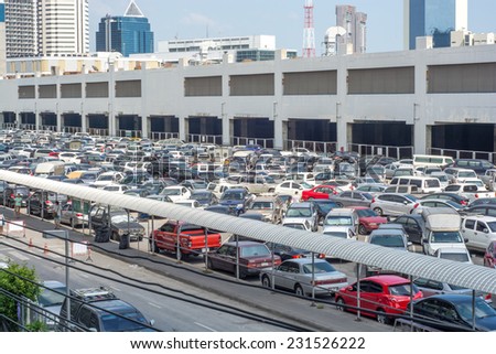 Bangkok,Thailand-November 16,2014:Cars parked at a park and side lot at a BTS station in Chatuchak district in Bangkok,Thailand.The government has promoted park and ride to reduce traffic congestion.