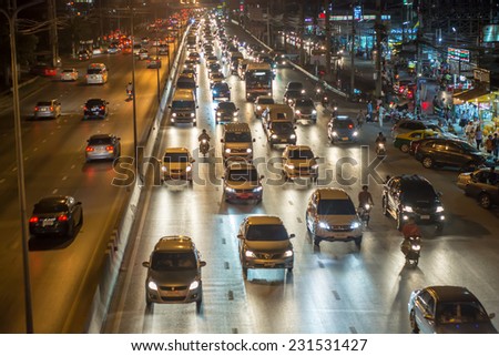 Pathumthani,Thailand-November 13,2014 : Night busy traffic in motion blur car at Ransit road in Pathumthani , Thailand.