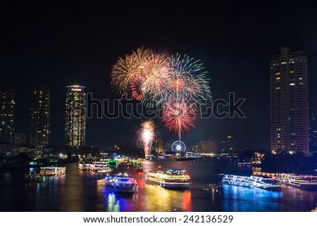 Bangkok,Thailand - December 31,2014 : The happy new year 2015 exploding fireworks over chaophraya river  in Bangkok,Thailand.