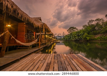 Kanchanaburi , Thailand - May 11,2015 : Sunset view at  The Forest Resort with raft house on River Kwai in Kanchanaburi, Thailand.