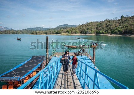 Surat Thani , Thailand - April 9,2015 : The tourist with long-tailed boat visiting lake and mountain at  pier in Khao Sok lake, Surat Thani Province, Thailand.