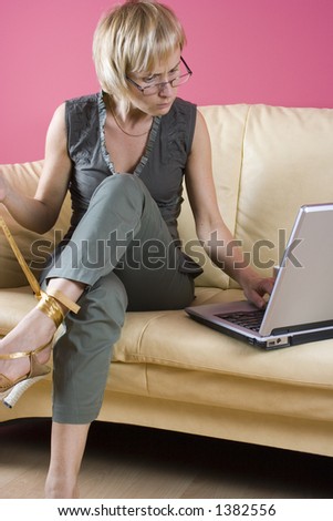 Working home on the sofa, take her shoe off