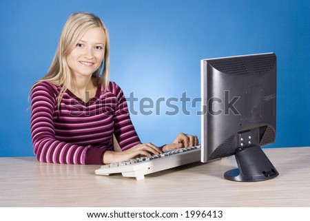 young blonde woman at the computer (blue background)