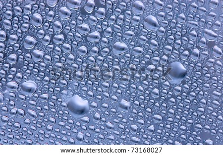 Abstract background. Condensate drops on a curved surface.