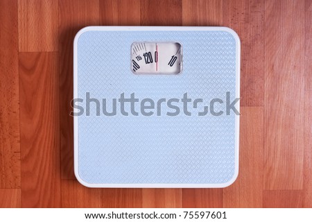 Closeup view of scales on a floor. Dieting concept.