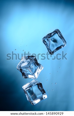 Ice cubes under water, blue color