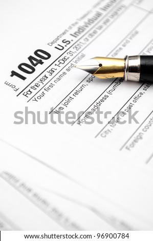 Tax Form being filled out with an antique fountain pen