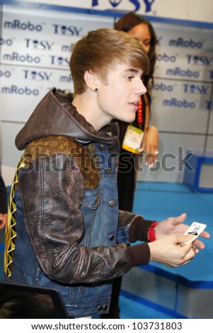 LAS VEGAS - JAN 11: Justin Bieber makes an appearance at the mRobo booth at the Consumer Electronics Show at The Las Vegas Convention Center in Las Vegas, NV on January 11,  2012.